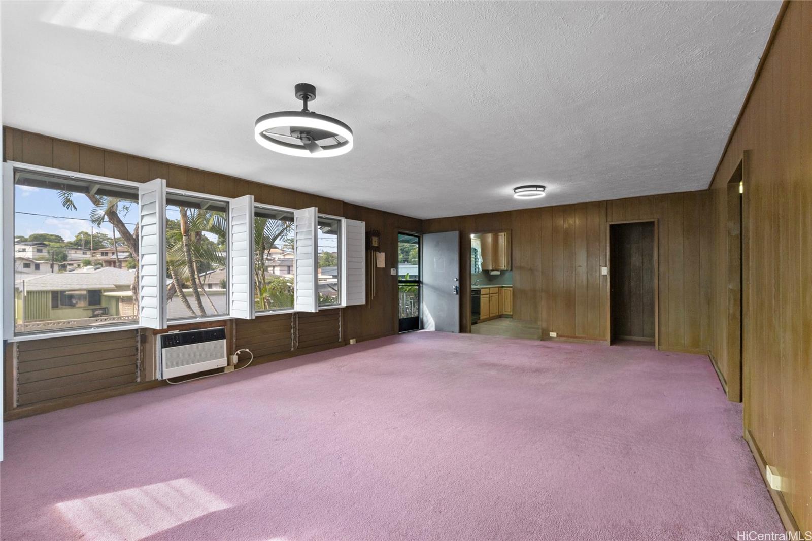 94-341 Kahuanani Street Waipahu, HI 96797 - Photo 3 of 24 a big room with windows and view of kitchen