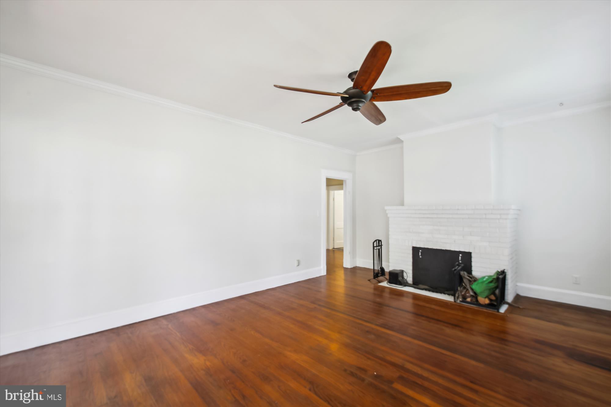 611 Clark Avenue Deale, MD 20751 - Photo 15 of 37 a view of empty room with wooden floor and fireplace