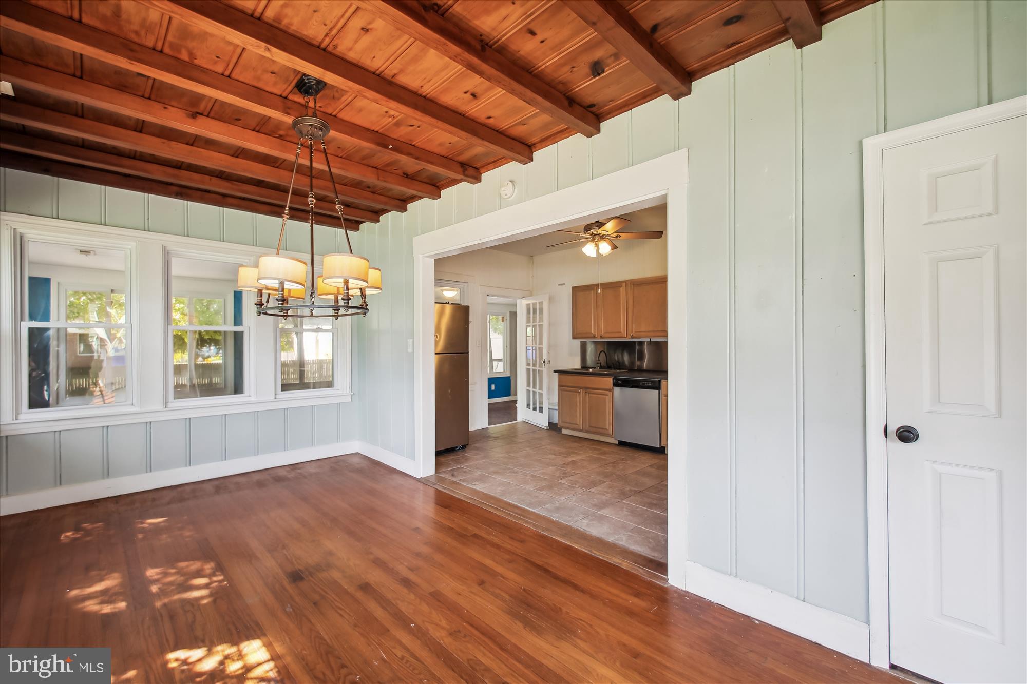 611 Clark Avenue Deale, MD 20751 - Photo 17 of 37 a view of a hallway with wooden floor and a kitchen