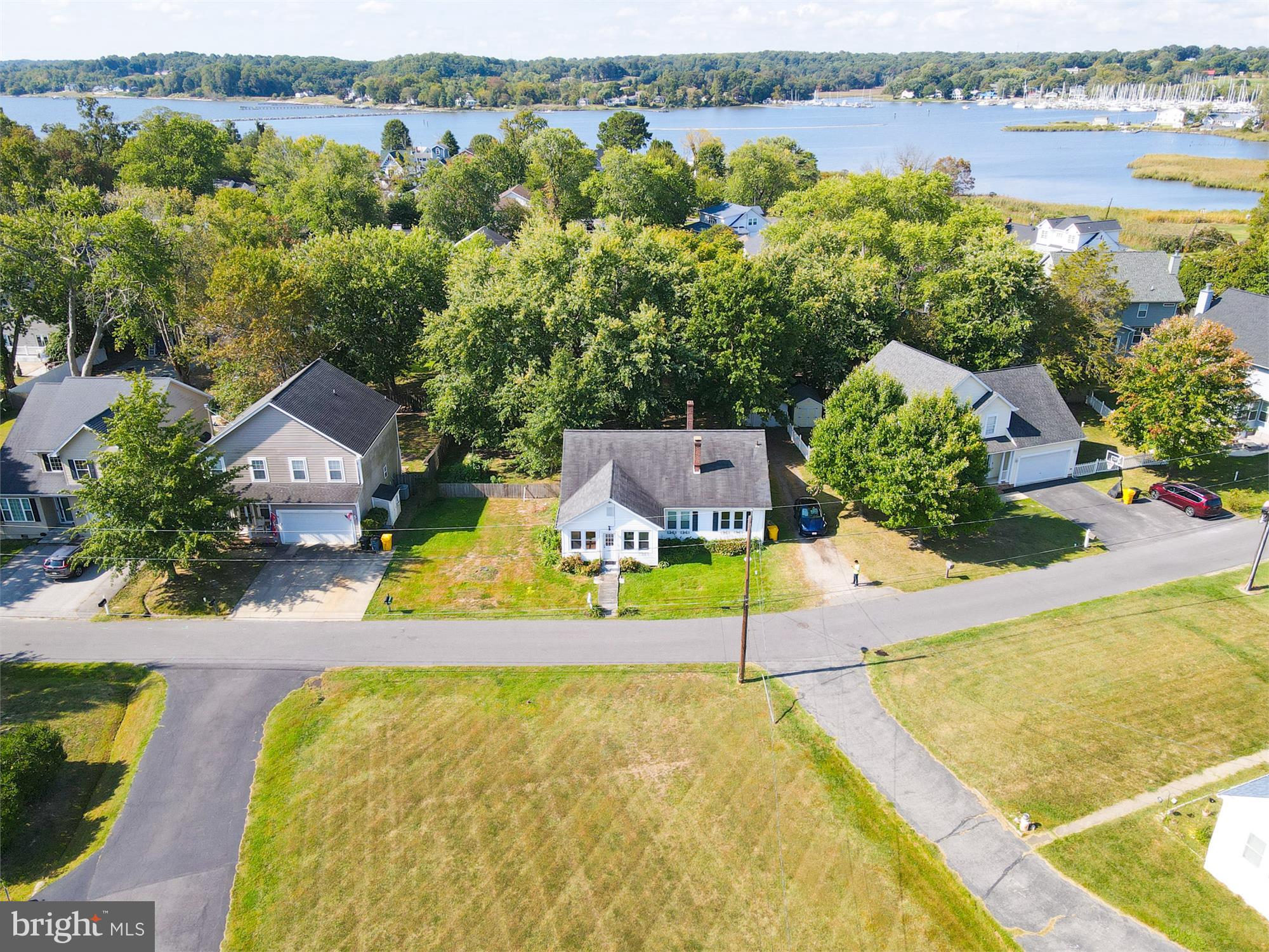 611 Clark Avenue Deale, MD 20751 - Photo 2 of 37 an aerial view of a house with a swimming pool and lake view