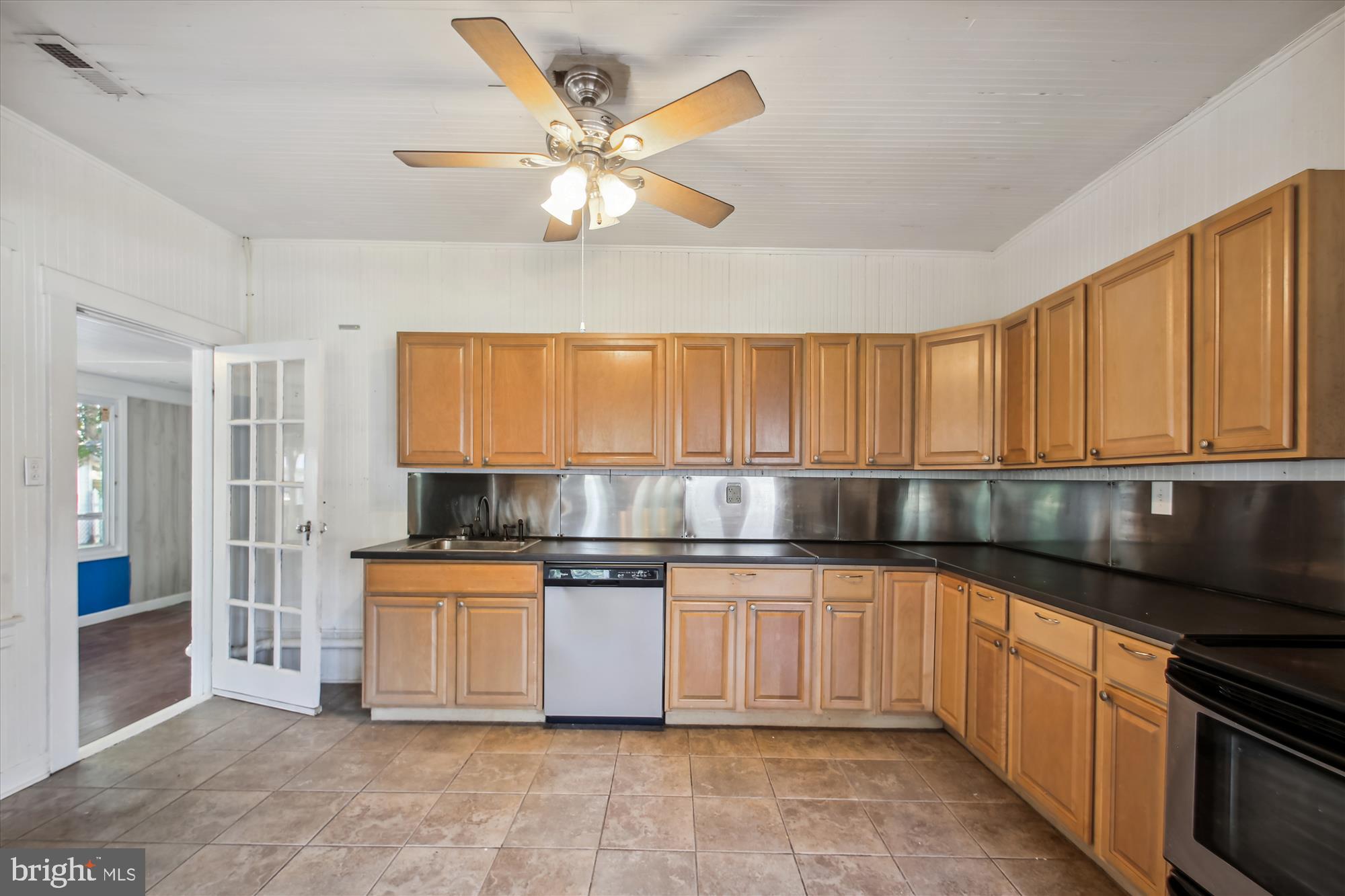 611 Clark Avenue Deale, MD 20751 - Photo 21 of 37 a kitchen with stainless steel appliances granite countertop a stove a sink and a refrigerator