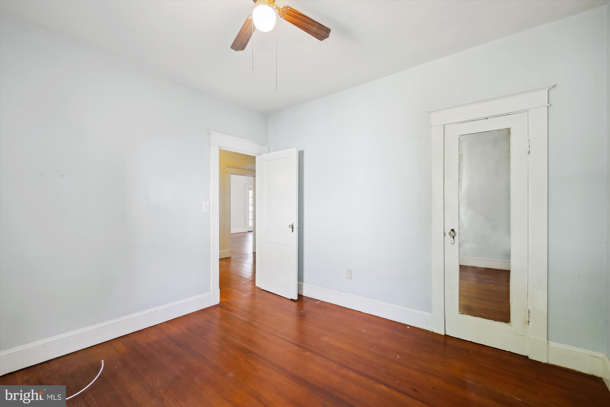 611 Clark Avenue Deale, MD 20751 - Photo 24 of 37 an empty room with wooden floor and ceiling fan