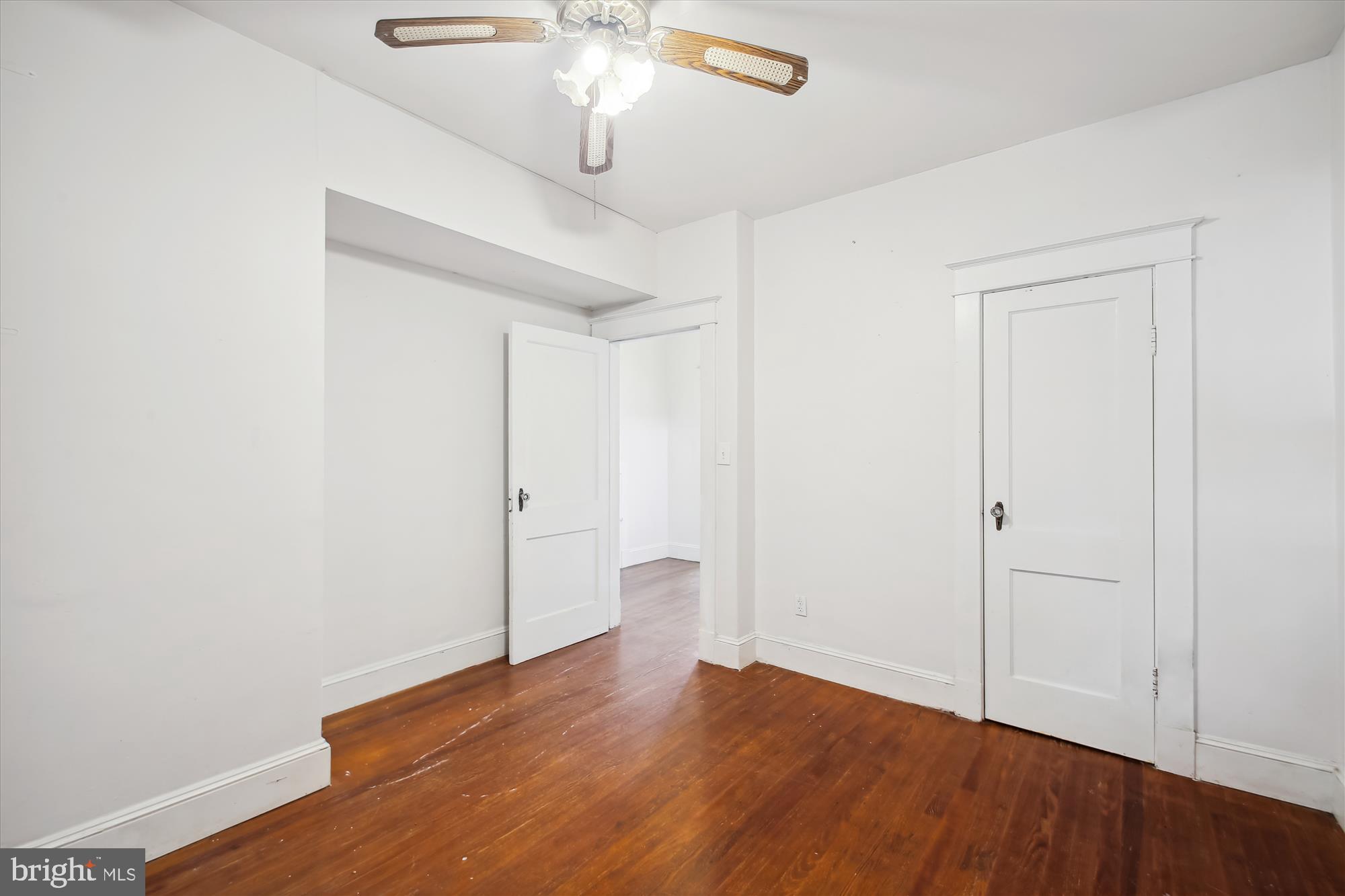 611 Clark Avenue Deale, MD 20751 - Photo 25 of 37 an empty room with wooden floor chandelier fan and closet area