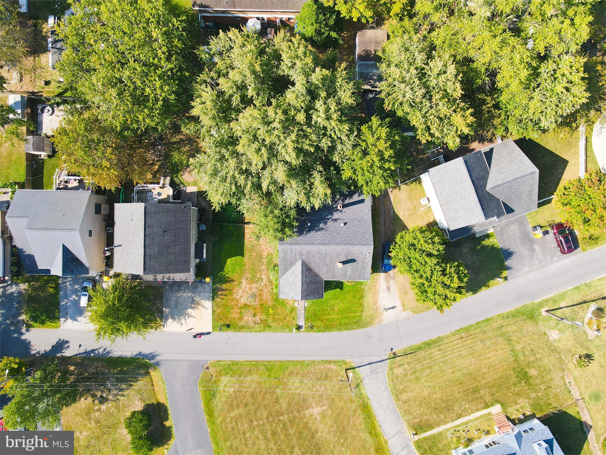 611 Clark Avenue Deale, MD 20751 - Photo 3 of 37 an aerial view of a house with swimming pool and large trees