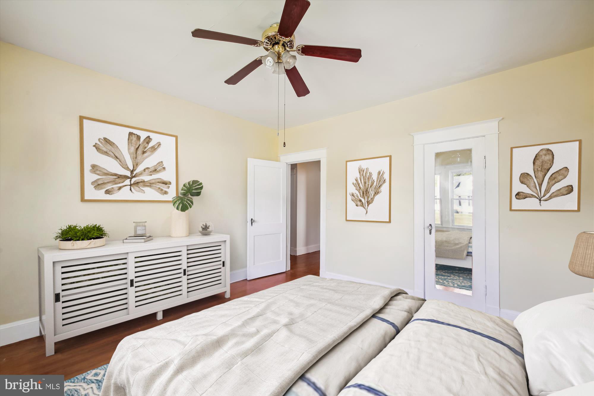 611 Clark Avenue Deale, MD 20751 - Photo 7 of 37 a bedroom with a bed and a chandelier