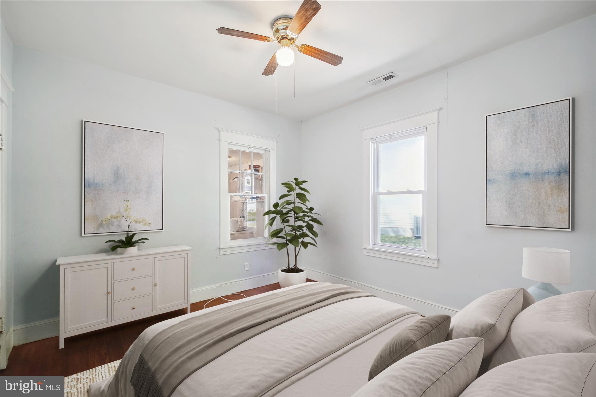 611 Clark Avenue Deale, MD 20751 - Photo 8 of 37 a bedroom with a bed and a chandelier