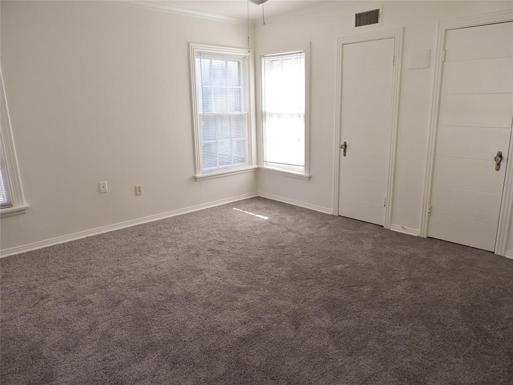 3425 Westcliff Road South Fort Worth, TX 76109 - Photo 12 of 22 Unfurnished bedroom with dark carpet and crown molding