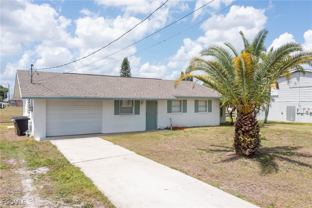 2019 Clark Avenue Fort Myers, FL 33905 - Photo 1 of 23 a front view of a house with a garden