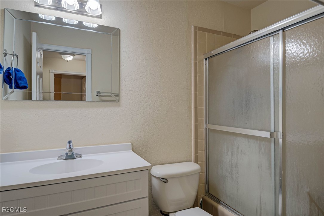 2019 Clark Avenue Fort Myers, FL 33905 - Photo 12 of 23 a bathroom with a sink a toilet and shower