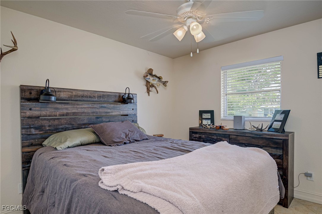 2019 Clark Avenue Fort Myers, FL 33905 - Photo 13 of 23 a bedroom with a bed and window