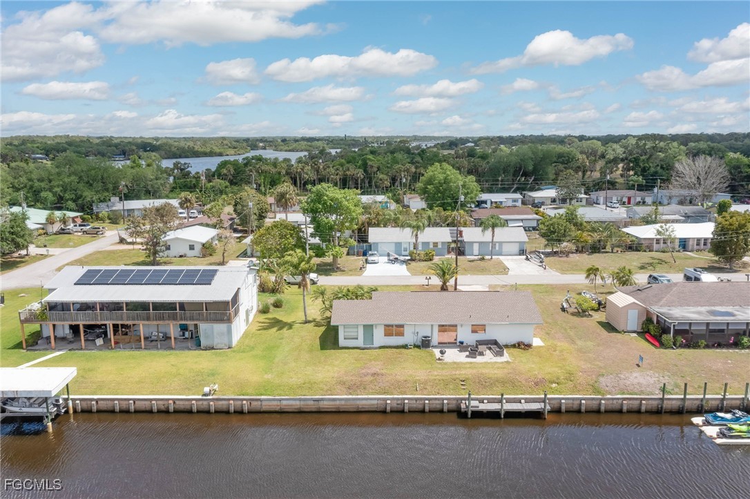 2019 Clark Avenue Fort Myers, FL 33905 - Photo 20 of 23 a view of a swimming pool with outdoor seating and yard in back