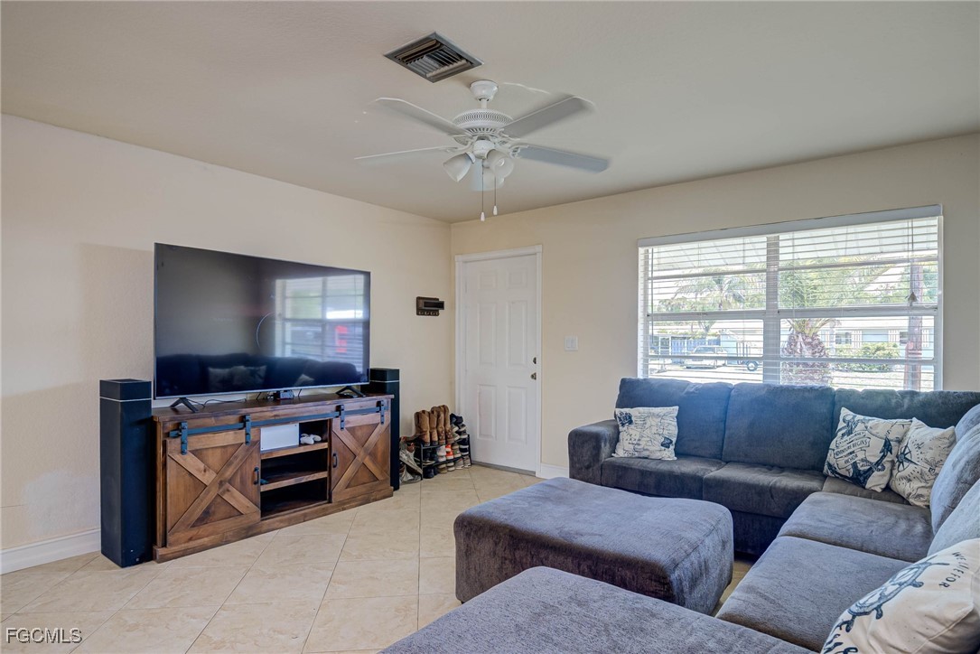2019 Clark Avenue Fort Myers, FL 33905 - Photo 3 of 23 a living room with furniture and a flat screen tv
