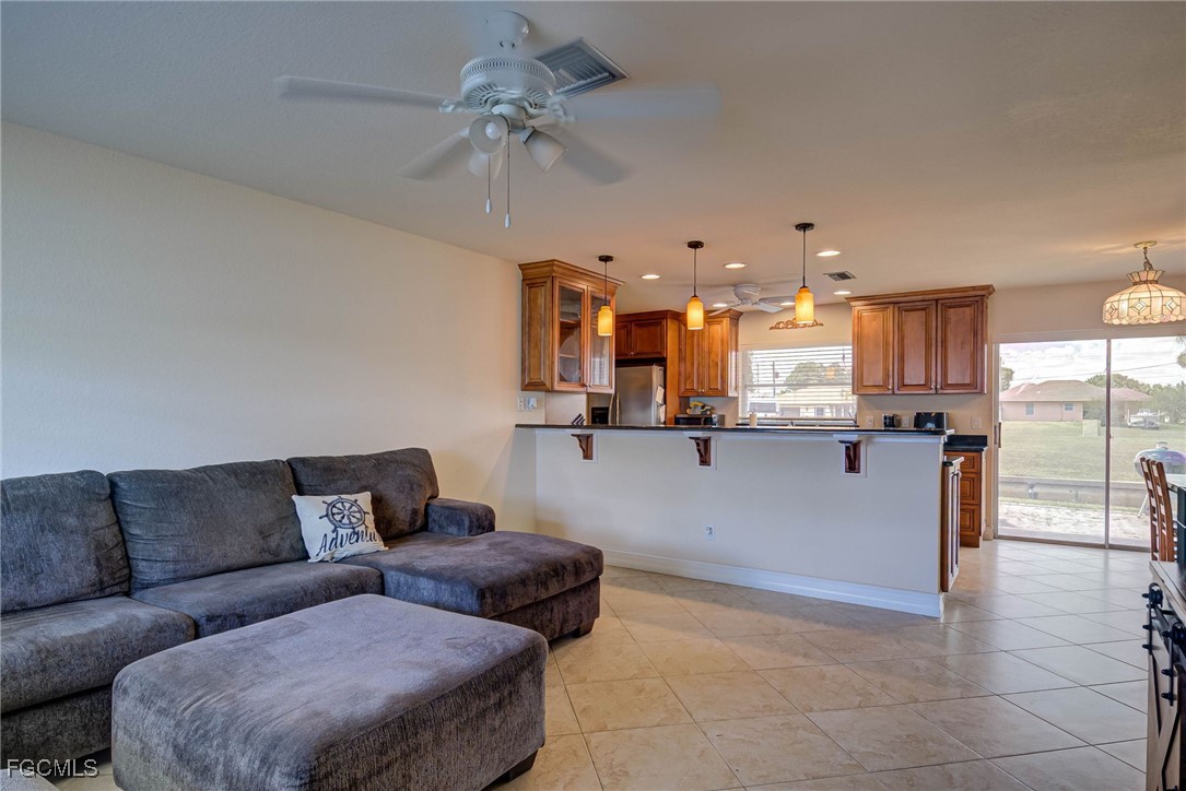 2019 Clark Avenue Fort Myers, FL 33905 - Photo 5 of 23 a living room with furniture and kitchen view