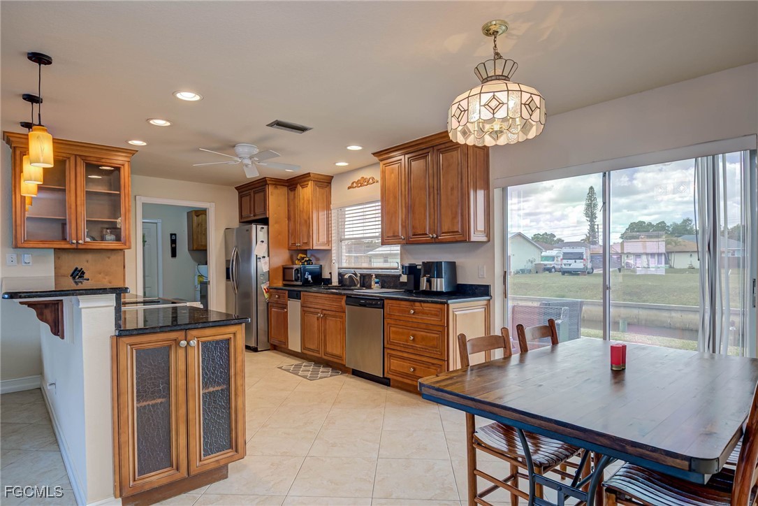 2019 Clark Avenue Fort Myers, FL 33905 - Photo 6 of 23 a open kitchen with stainless steel appliances granite countertop a stove and refrigerator