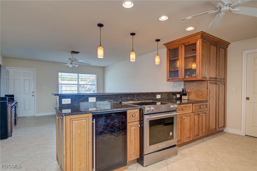 2019 Clark Avenue Fort Myers, FL 33905 - Photo 8 of 23 a kitchen with stainless steel appliances granite countertop a stove a sink and a refrigerator