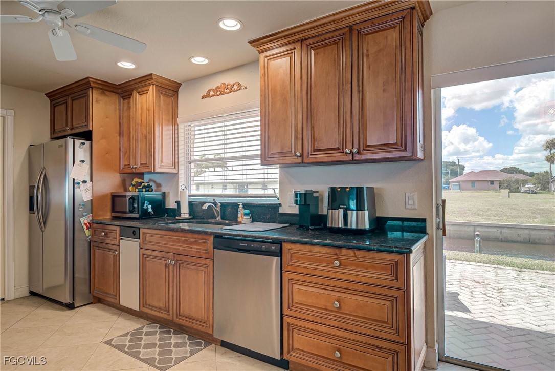 2019 Clark Avenue Fort Myers, FL 33905 - Photo 9 of 23 a kitchen with granite countertop a refrigerator and a sink