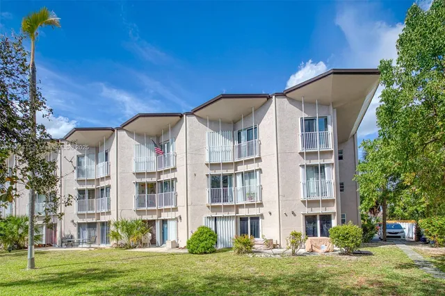 a view of a chairs and table in the yard