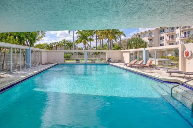 a view of a swimming pool with a patio