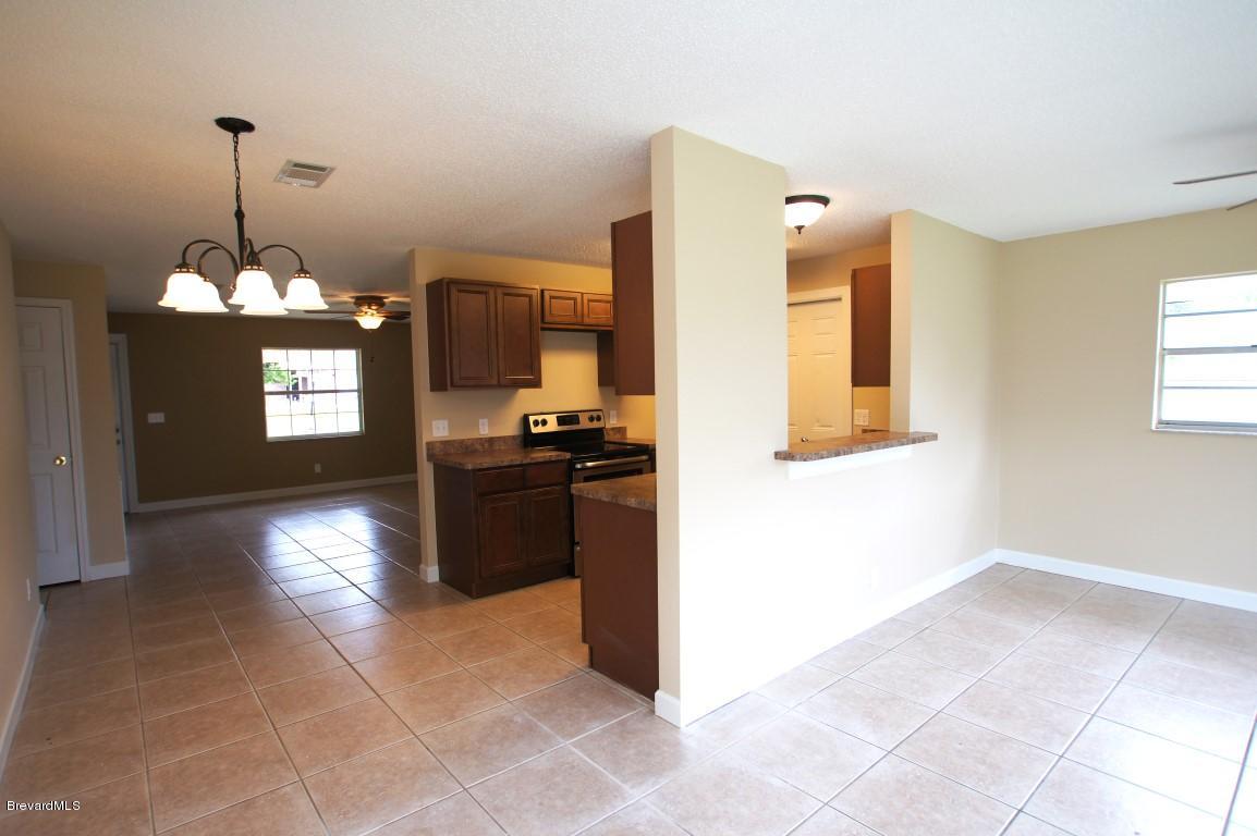 6450 Hudson Road Cocoa, FL 32927 - Photo 5 of 15 Hudson Rd-Living_Kitchen.jpg