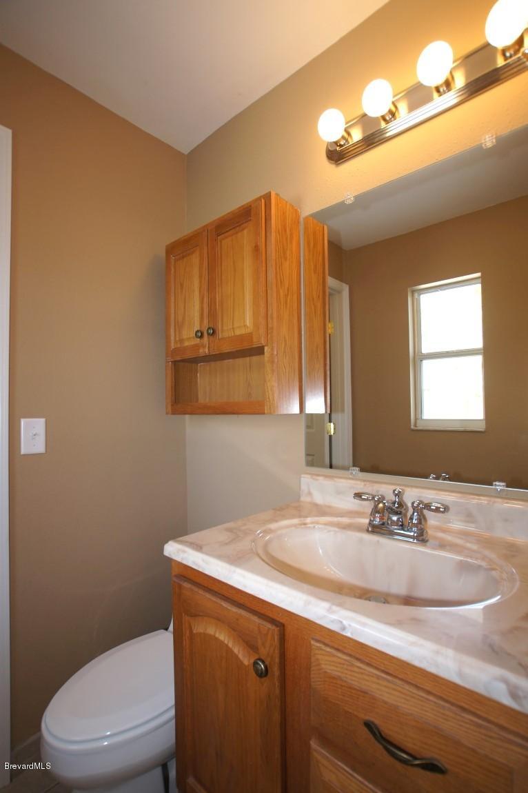 6450 Hudson Road Cocoa, FL 32927 - Photo 10 of 15 Hudson 6450-Half Bath.jpg
