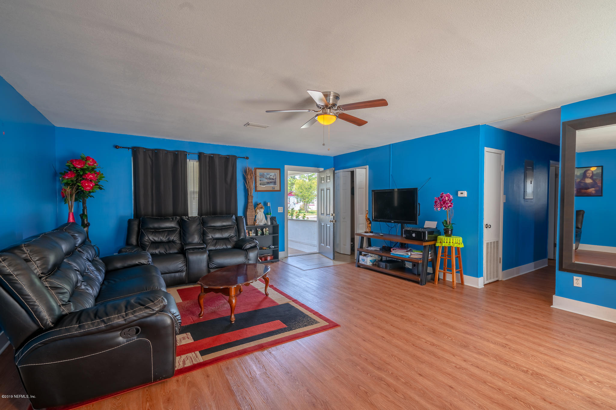 4519 Barnes Road South Jacksonville, FL 32207 - Photo 17 of 46 a living room with furniture and a flat screen tv