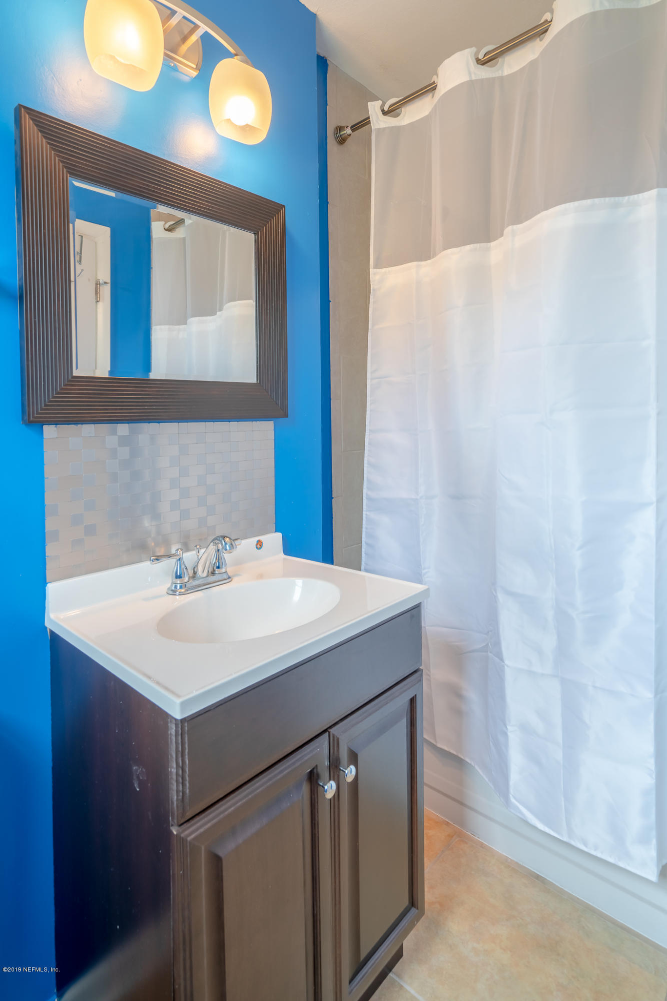 4519 Barnes Road South Jacksonville, FL 32207 - Photo 21 of 46 a bathroom with a sink and a mirror