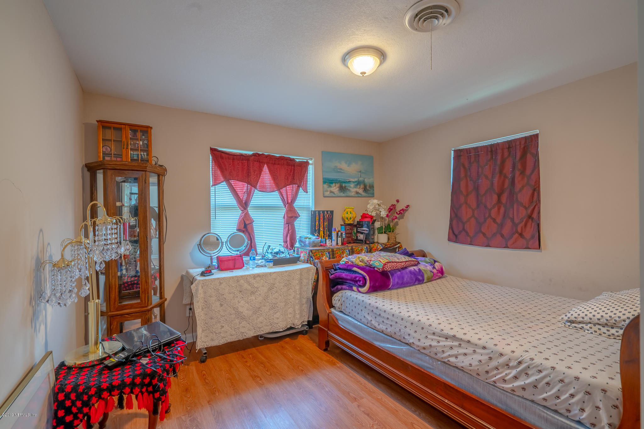4519 Barnes Road South Jacksonville, FL 32207 - Photo 24 of 46 a bedroom with a bed and a couch