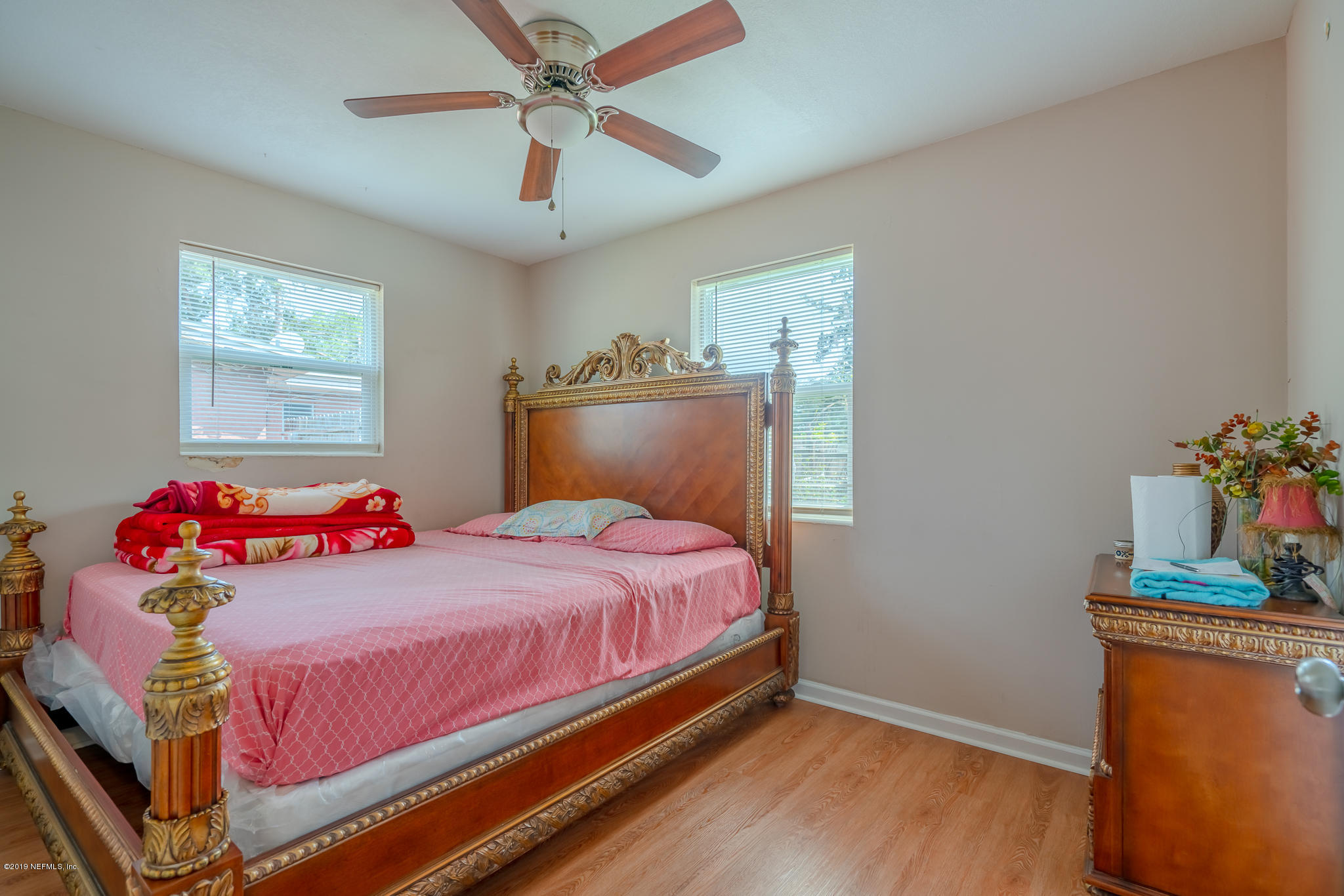 4519 Barnes Road South Jacksonville, FL 32207 - Photo 31 of 46 a bedroom with a bed and wooden floor
