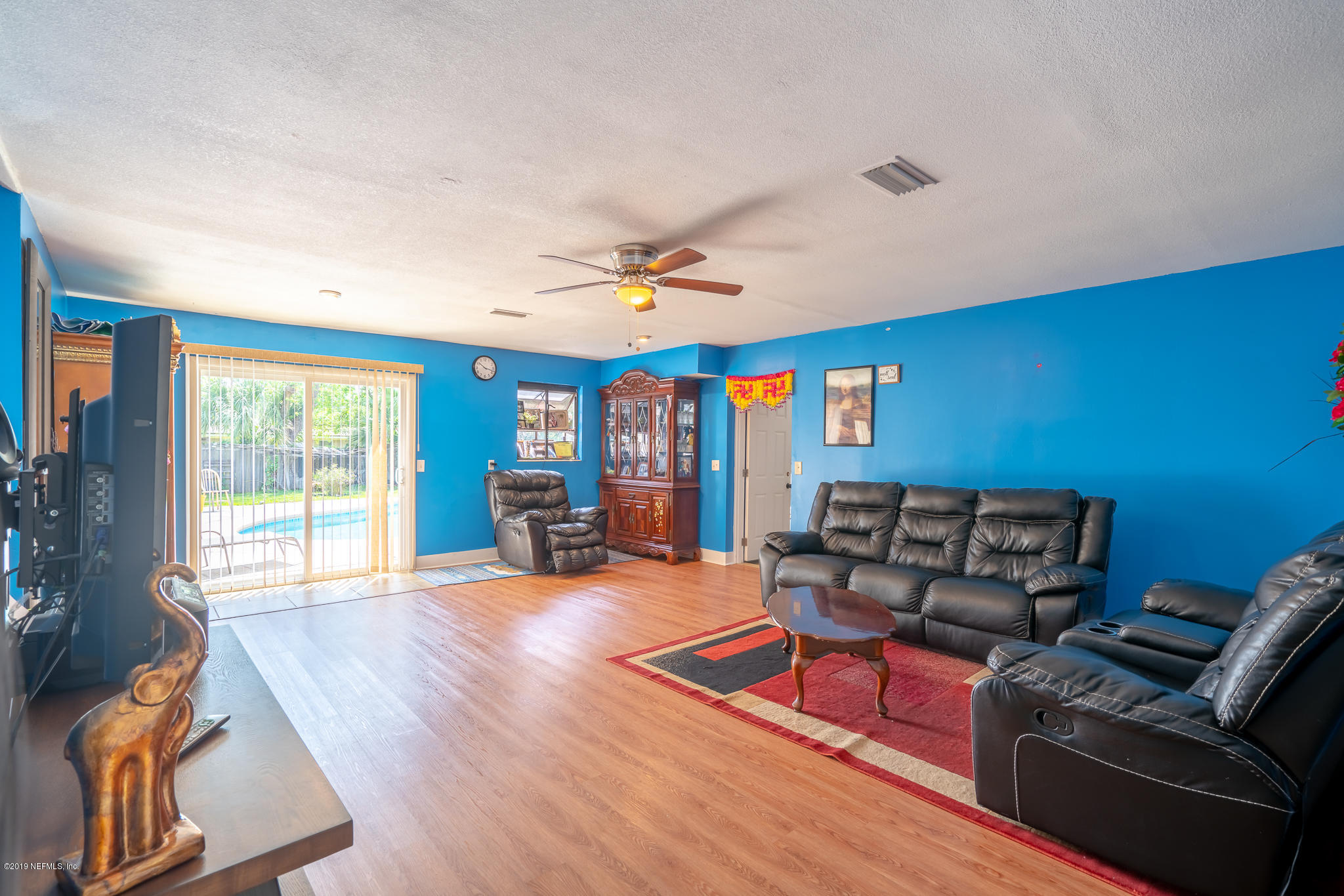 4519 Barnes Road South Jacksonville, FL 32207 - Photo 38 of 46 a living room with furniture a flat screen tv and a large window