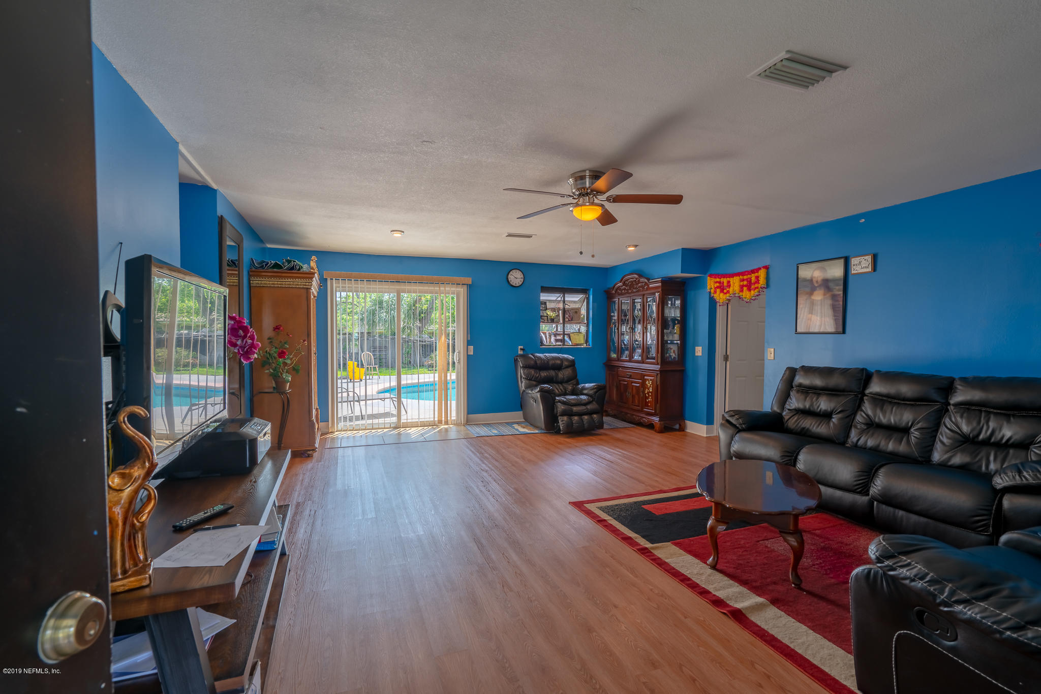 4519 Barnes Road South Jacksonville, FL 32207 - Photo 46 of 46 a living room with furniture a wooden floor and next to a window