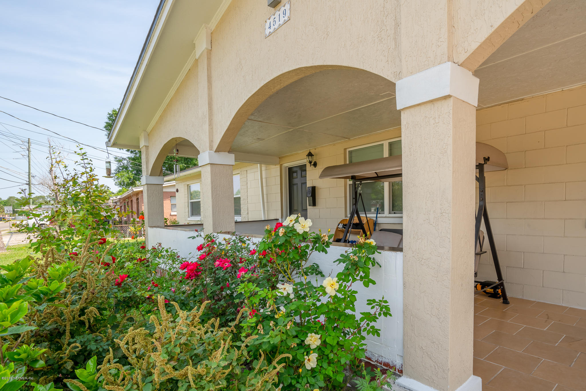 4519 Barnes Road South Jacksonville, FL 32207 - Photo 5 of 46 a front view of a house with a garden