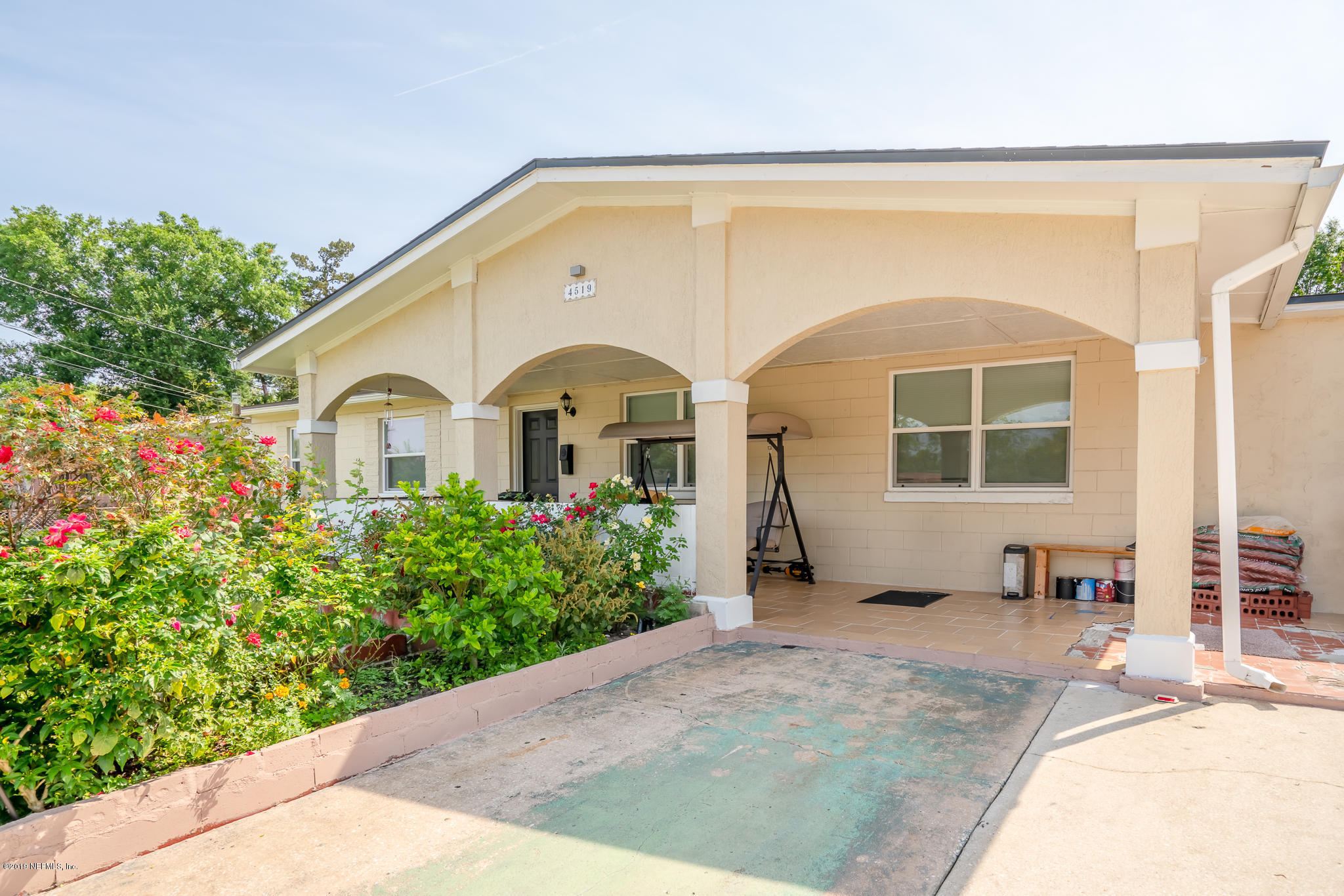 4519 Barnes Road South Jacksonville, FL 32207 - Photo 7 of 46 a front view of a house with a garden