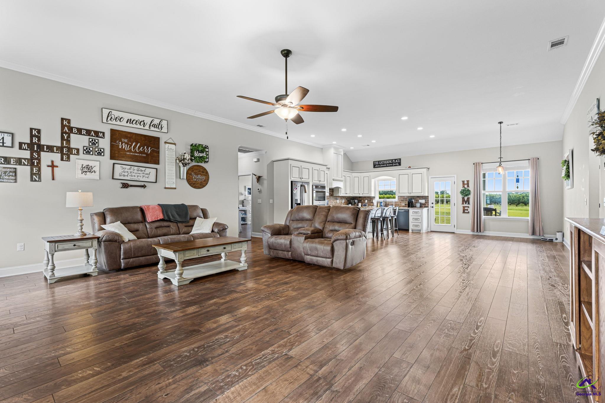 180 Woodland Trail Road Cochran, GA 31014 - Photo 5 of 25 a living room with furniture and kitchen view
