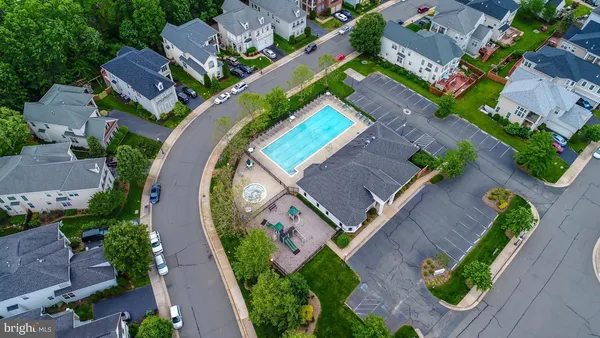 an aerial view of a house with a swimming pool
