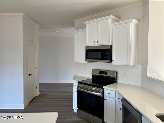 208 Trellis Walk Macon, GA 31220 - Photo 20 of 29 a kitchen with stainless steel appliances a stove a microwave and a hard wood floors