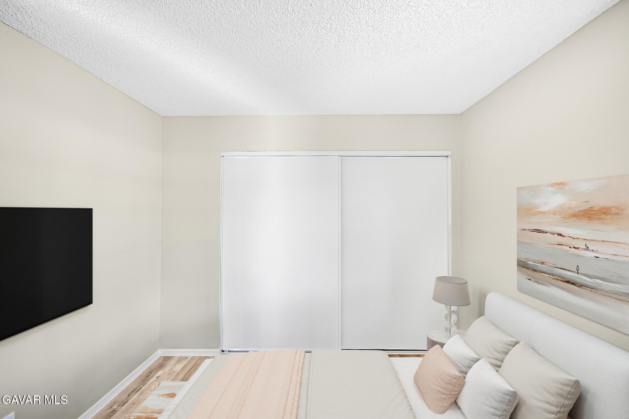 40523 172nd Street East Lancaster, CA 93535 - Photo 11 of 20 a bedroom with a bed and a flat screen tv