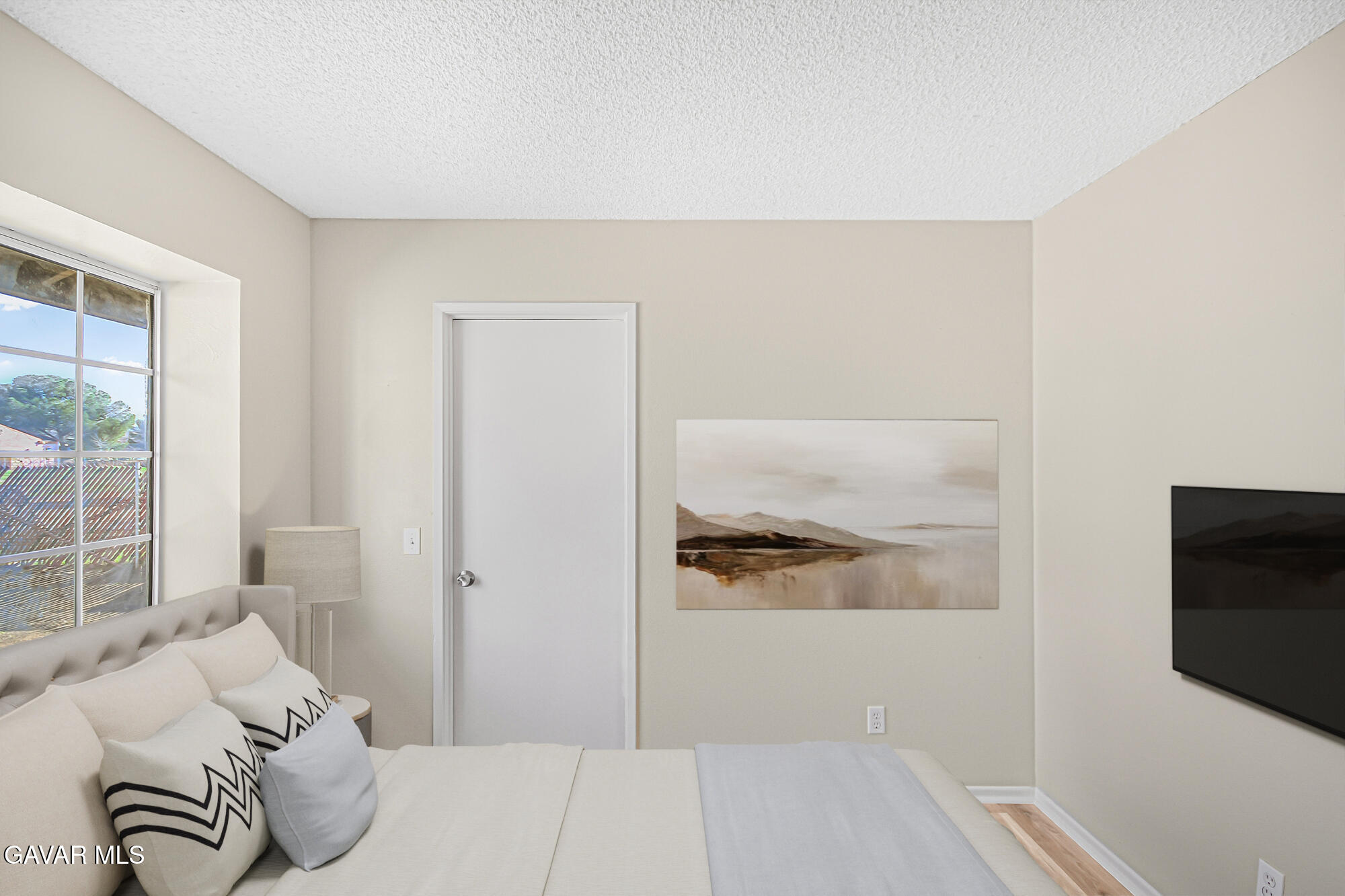 40523 172nd Street East Lancaster, CA 93535 - Photo 13 of 20 a bedroom with a bed and a flat screen tv