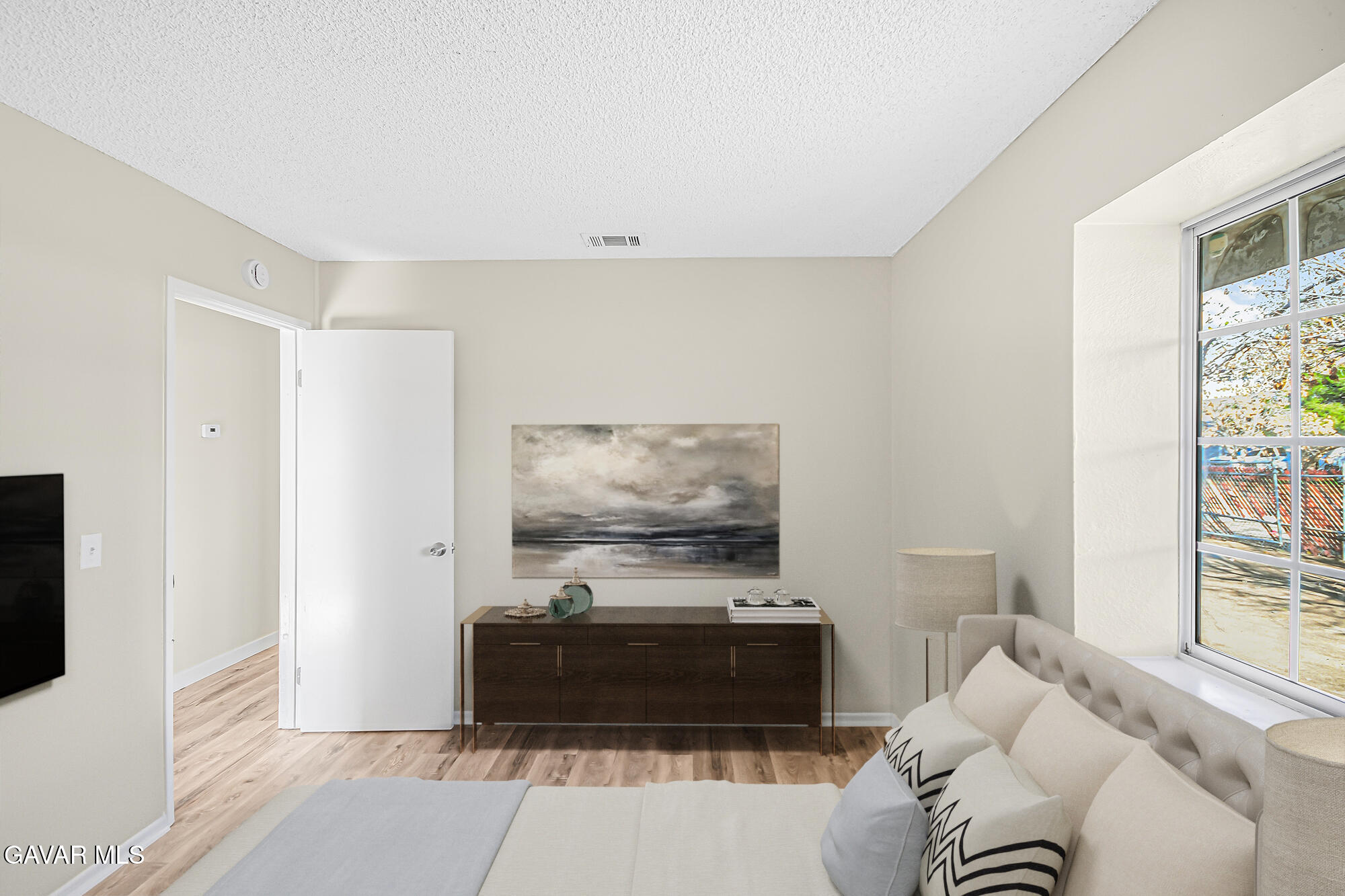 40523 172nd Street East Lancaster, CA 93535 - Photo 14 of 20 a living room with furniture and a flat screen tv