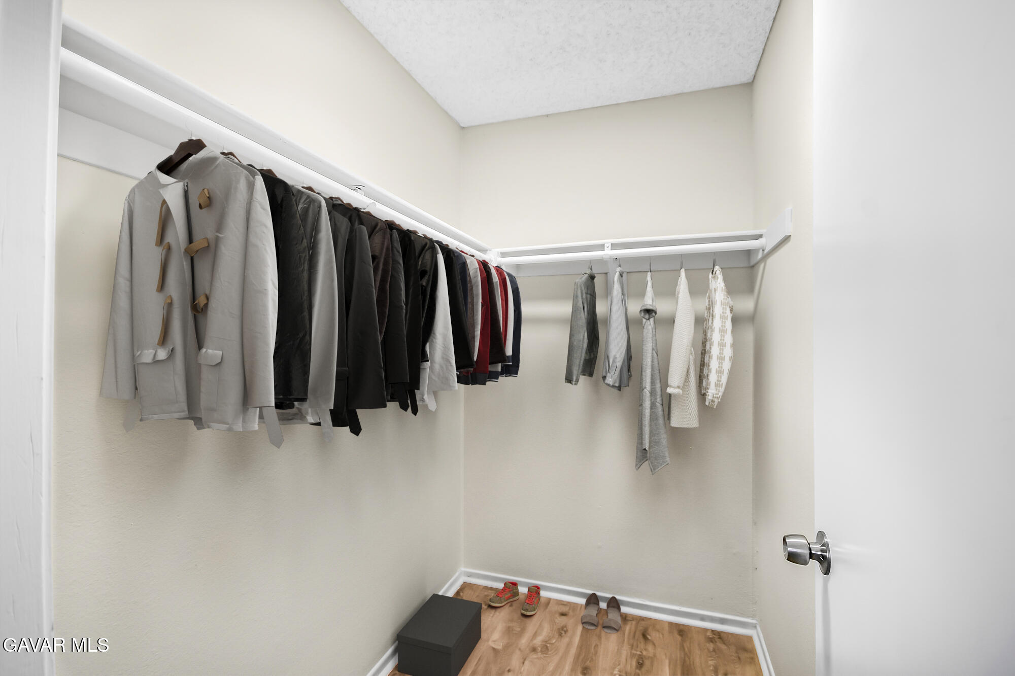 40523 172nd Street East Lancaster, CA 93535 - Photo 15 of 20 a view of walk in closet with clothes and shoes
