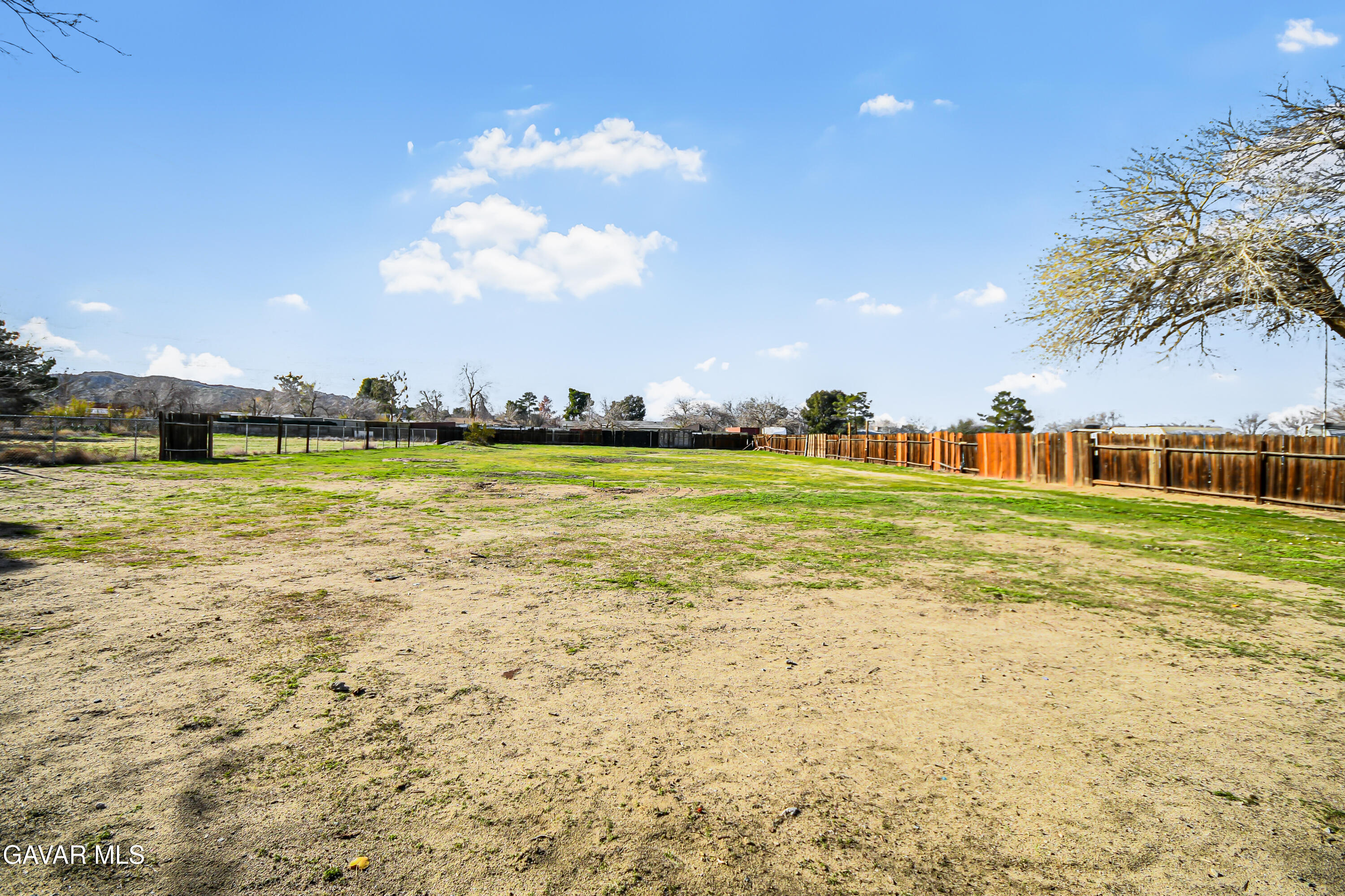 40523 172nd Street East Lancaster, CA 93535 - Photo 18 of 20 a view of a swimming pool with an outdoor space and seating area