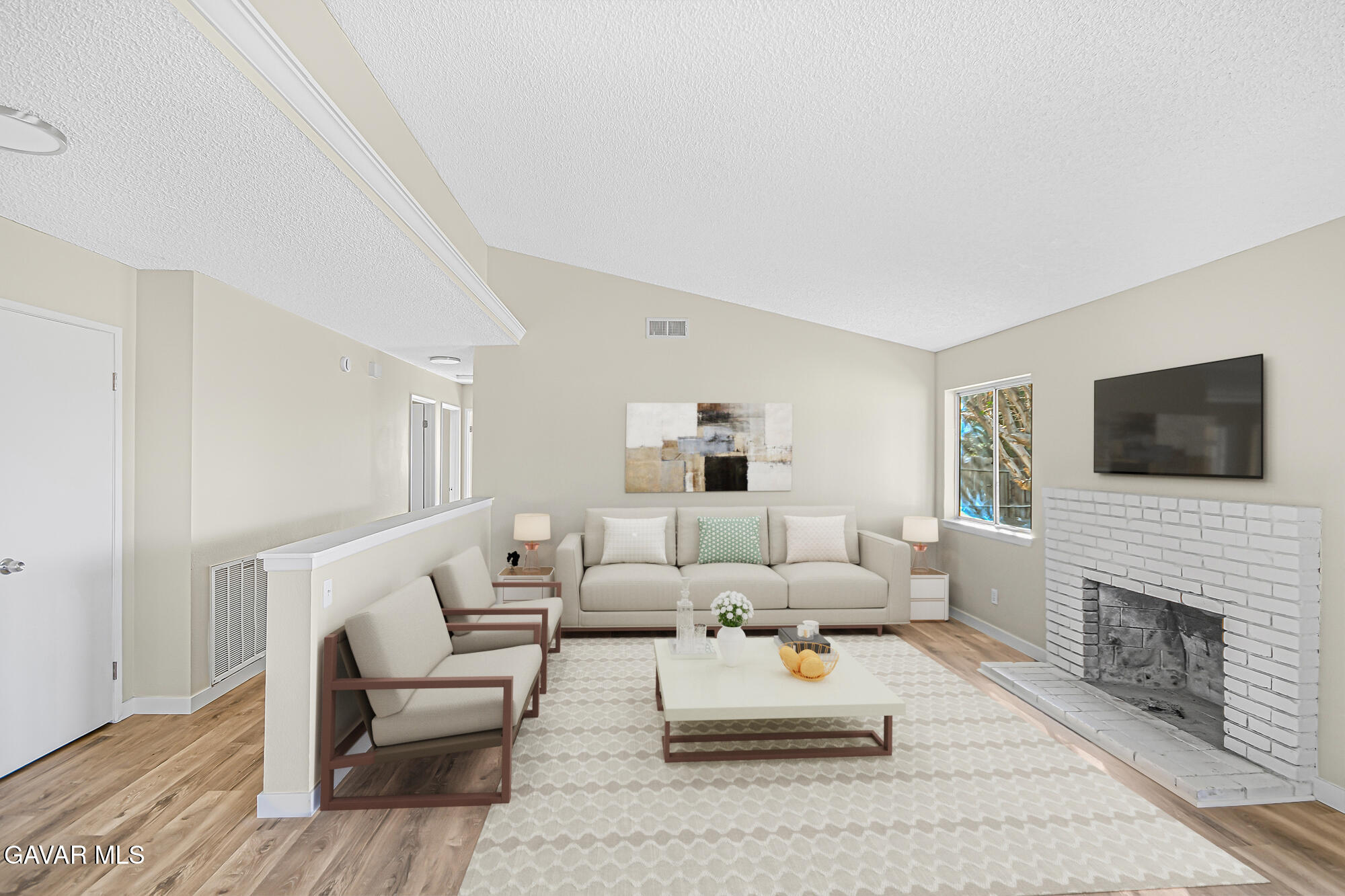 40523 172nd Street East Lancaster, CA 93535 - Photo 4 of 20 a living room with furniture a flat screen tv and a fireplace