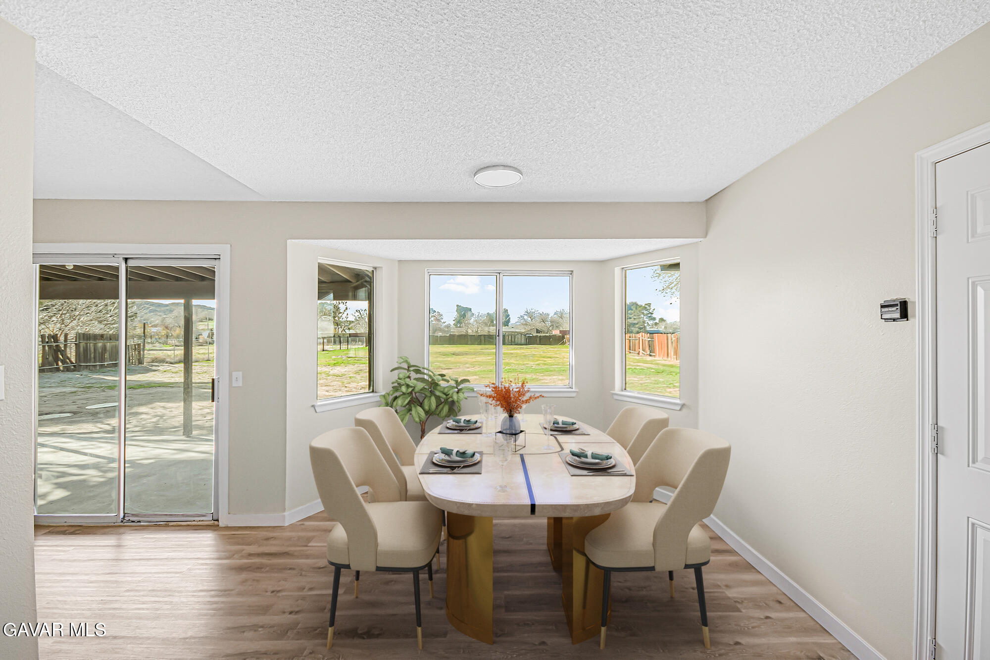 40523 172nd Street East Lancaster, CA 93535 - Photo 6 of 20 a view of a dining room with furniture window and wooden floor