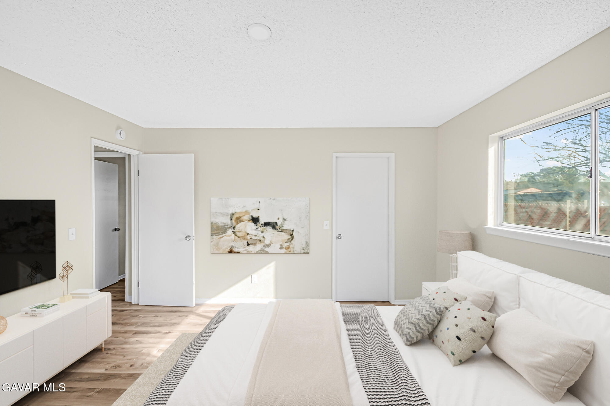 40523 172nd Street East Lancaster, CA 93535 - Photo 8 of 20 a bedroom with a large bed and a large window