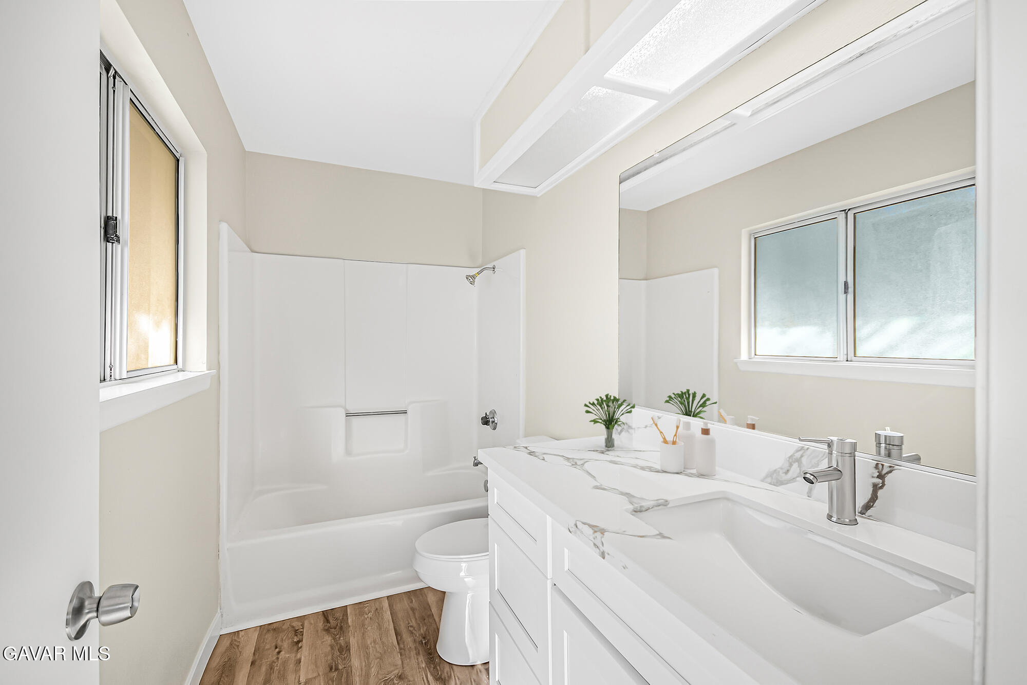 40523 172nd Street East Lancaster, CA 93535 - Photo 9 of 20 a bathroom with a sink toilet vanity and tub