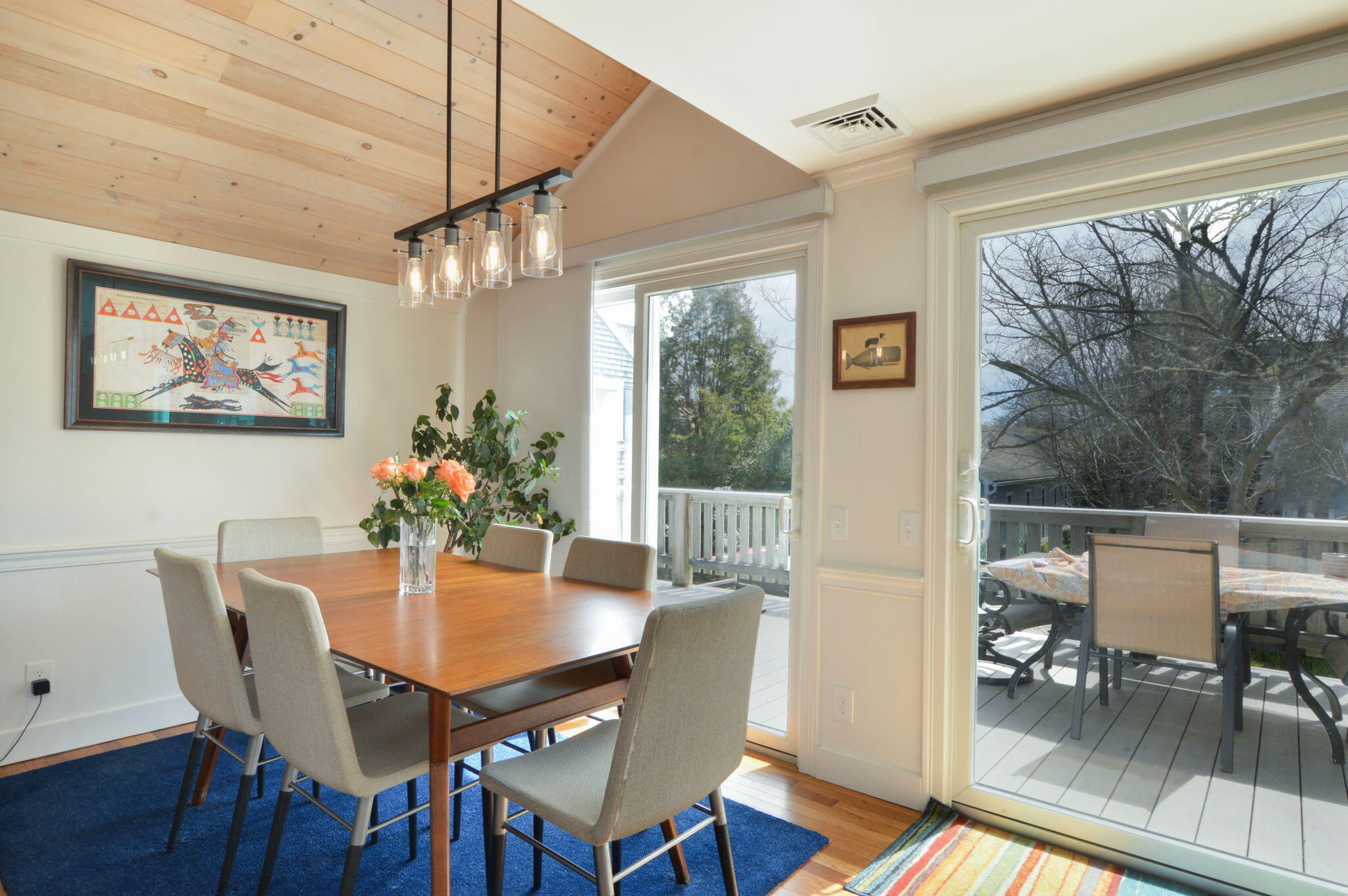 190 Pine Lane Osterville, MA 02655 - Photo 11 of 39 a dining room with furniture a large window and wooden floor