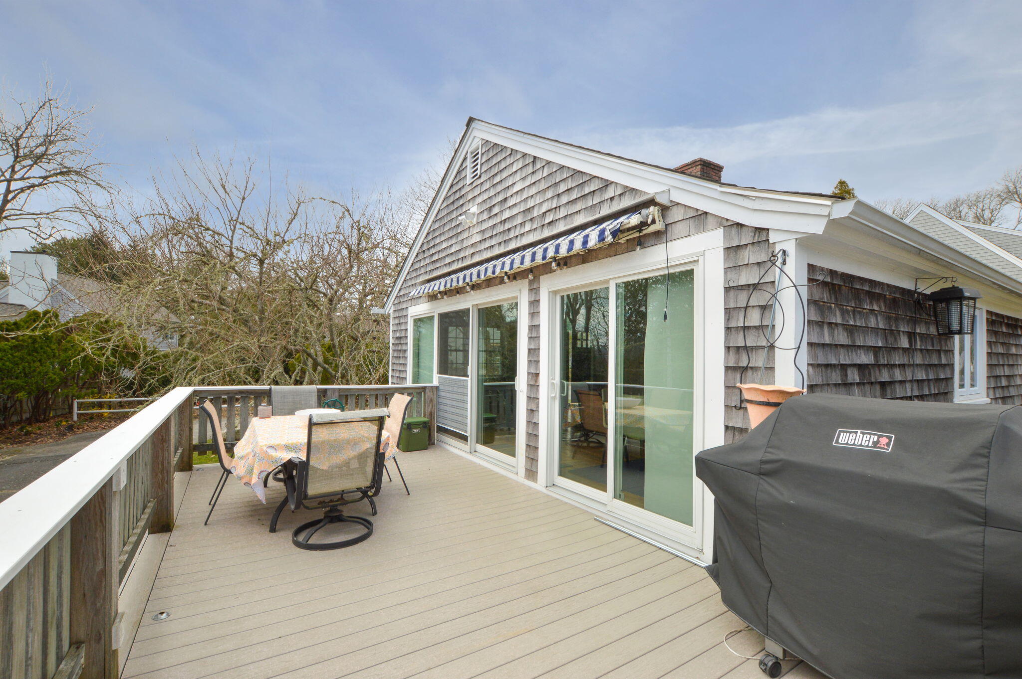 190 Pine Lane Osterville, MA 02655 - Photo 18 of 39 a view of a roof deck with couches and wooden floor