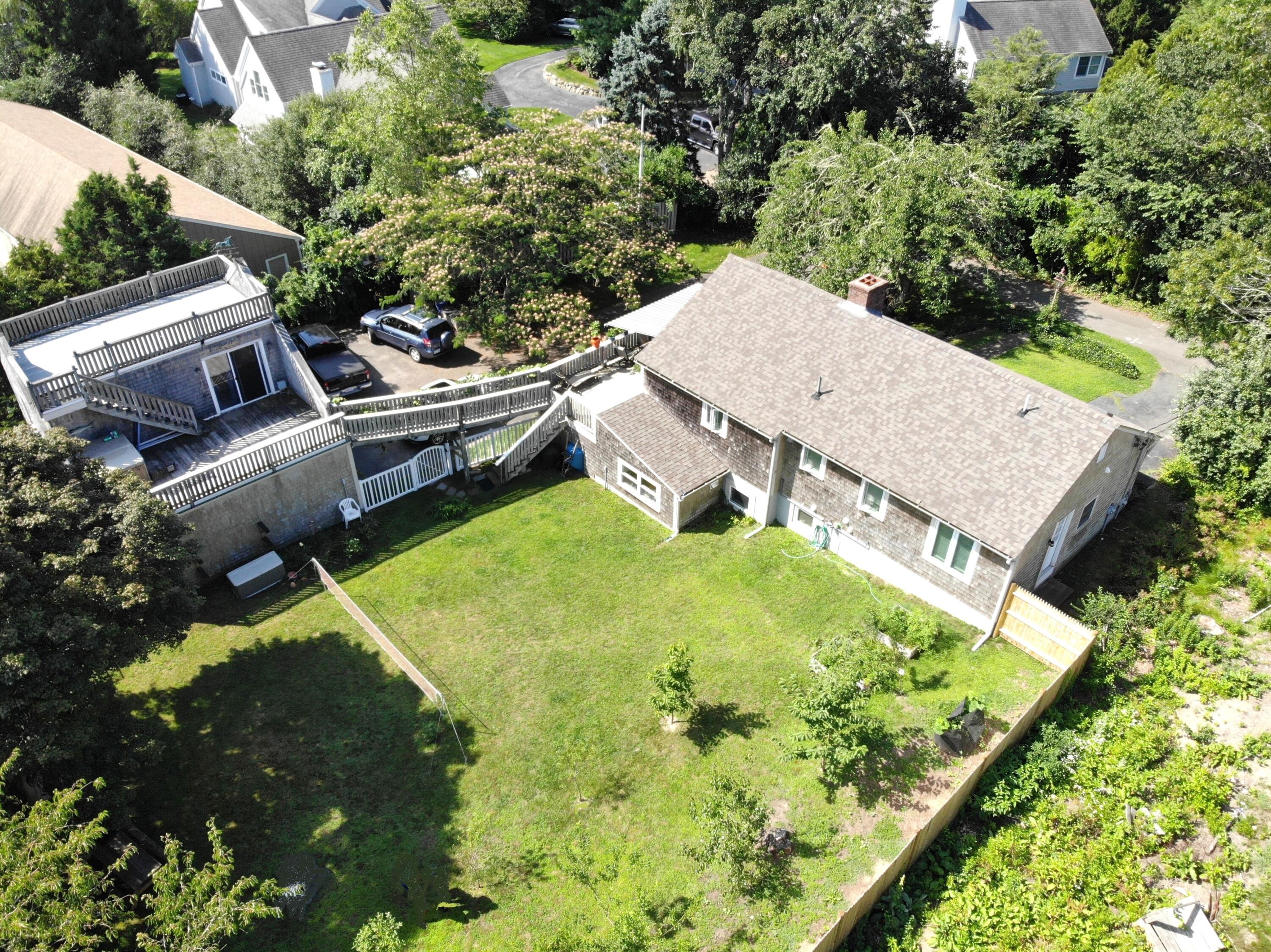 190 Pine Lane Osterville, MA 02655 - Photo 2 of 39 an aerial view of a house with yard swimming pool and outdoor seating