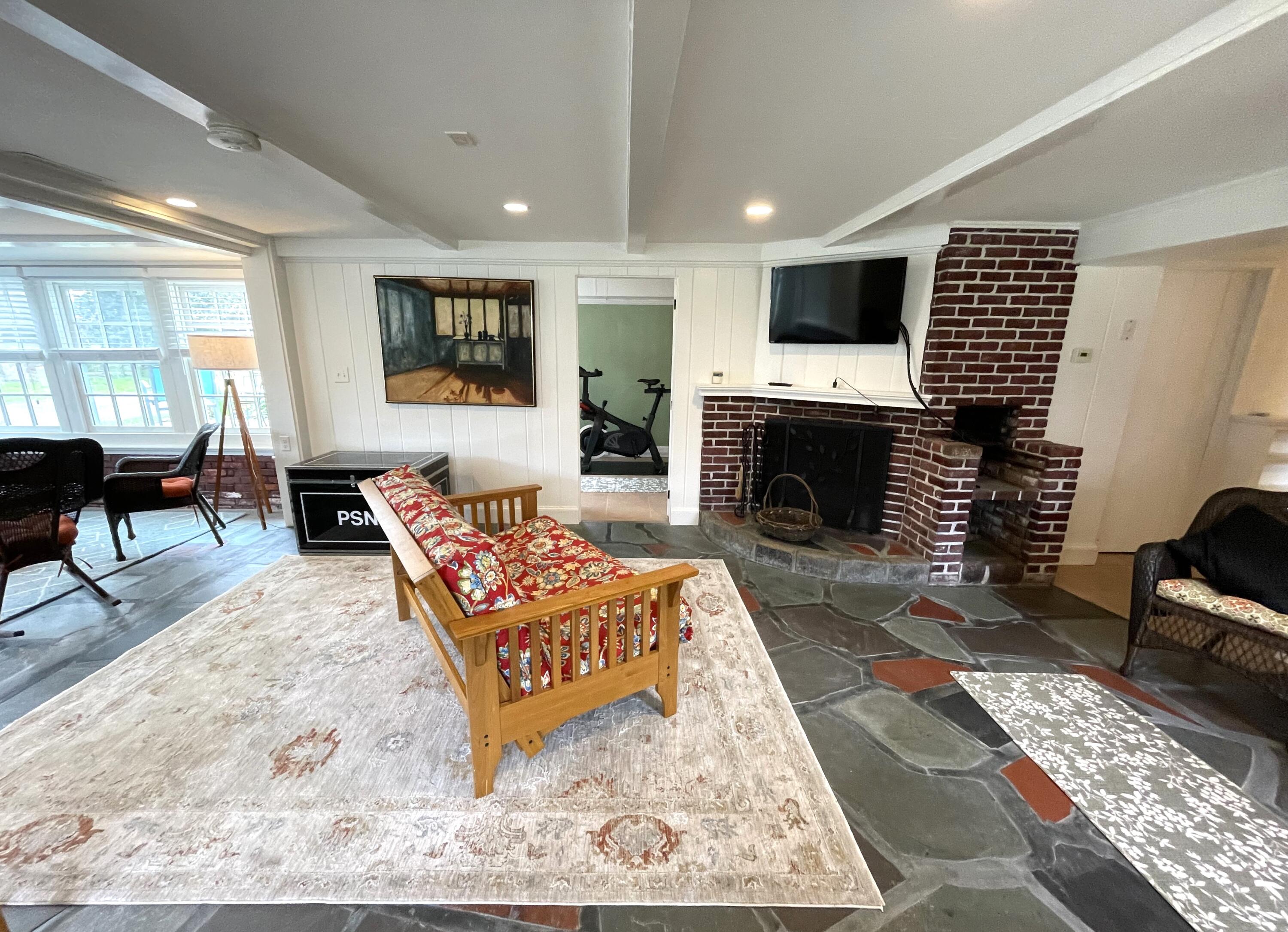 190 Pine Lane Osterville, MA 02655 - Photo 21 of 39 a living room with furniture a flat screen tv and a fireplace