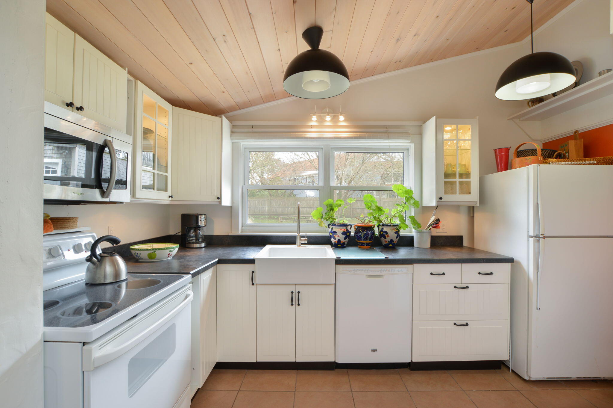 190 Pine Lane Osterville, MA 02655 - Photo 24 of 39 a kitchen with white cabinets and white appliances