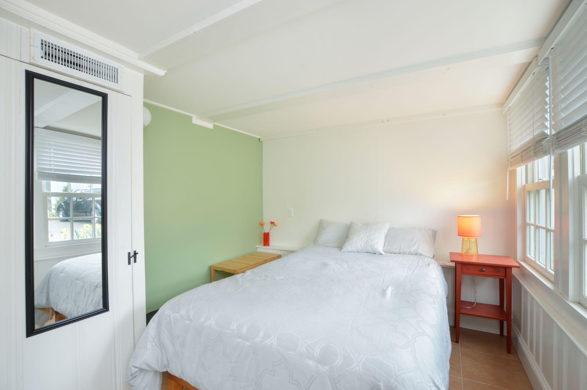 190 Pine Lane Osterville, MA 02655 - Photo 26 of 39 a bedroom with a bed and sliding door